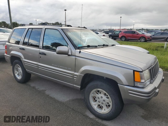 1998 Jeep Grand Cherokee Limited with VIN 1J4GZ78S2WC222768, listed as a Copart auction lot 73942154 with Not provided miles and Salvage title. Bid and sale history available at DreamBid. Image 4.