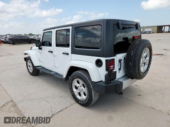 2014 Jeep Wrangler Unlimited Sahara with VIN 1C4BJWEG5EL309502, listed as a Copart auction lot 61804885 with 60,683 mi miles and Salvage title. Bid and sale history available at DreamBid. Image 2.