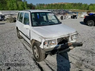 1997 Geo Tracker LSi z VIN 2CNBE1360V6927915, wystawiony jako Copart lot #53469605 z przebiegiem 119 413 mil mil oraz Szkoda całkowita • Salvage title. Historia ofert i sprzedaży dostępna na DreamBid. Obrazek 11.
