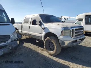 2002 Ford F-250 XL with VIN 1FTNW20F12EA44390, listed as a Copart auction lot 83888084 with 285,250 mi miles and Salvage Title. Bid and sale history available at DreamBid. Image 4.