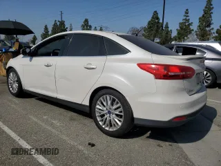 2017 Ford Focus Titanium with VIN 1FADP3J2XHL291606, listed as a Copart auction lot 58268285 with 153,272 mi miles and Salvage title. Bid and sale history available at DreamBid. Image 2.