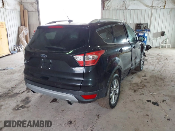 2017 Ford Escape Titanium with VIN 1FMCU0JD2HUE71179, listed as a IAAI auction lot 41465849 with 95,426 mi miles. Bid and sale history available at carsss.com. Image 4.