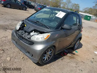 2009 Smart fortwo Pure with VIN WMEEJ31X99K302227, listed as a IAAI auction lot 41900573 with 30,730 mi miles. Bid and sale history available at carsss.com. Image 2.