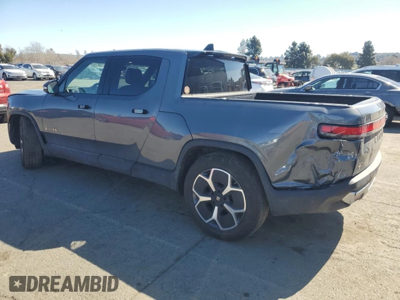 2022 Rivian R1T Adventure z VIN 7FCTGAAA5NN014843, wystawiony jako Copart lot #47668545 z przebiegiem 42 640 mil mil oraz Szkody całkowita. Historia ofert i sprzedaży dostępna na DreamBid. Obrazek 2.