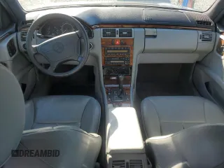 1998 Mercedes-Benz E-Class with VIN WDBJF65F3WA642006, listed as a Copart auction lot 87309994 with 129,837 mi miles and Salvage Title. Bid and sale history available at carsss.com. Image 8.