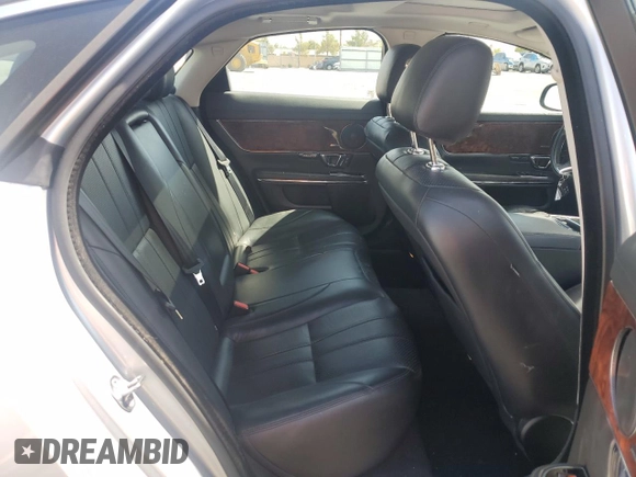2015 Jaguar XJ with VIN SAJWJ1CD4F8V82496, listed as a Copart auction lot 71013474 with 52,744 mi miles and Salvage title. Bid and sale history available at DreamBid. Image 10.