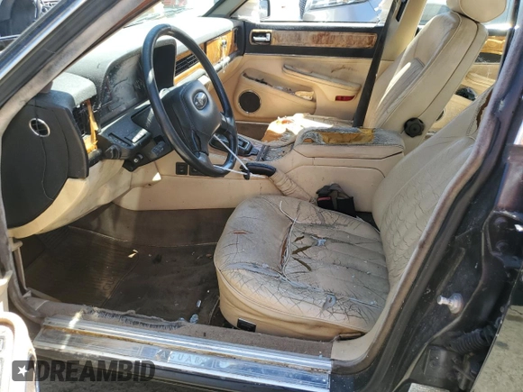 1990 Jaguar XJ with VIN SAJKY1745LC622713, listed as a Copart auction lot 56545414 with Not Provided miles and Salvage Title. Bid and sale history available at DreamBid. Image 7.