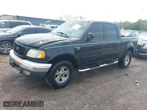 2002 Ford F-150 XLT with VIN 1FTRW08L72KD27457, listed as a IAAI auction lot 41993148 with 372,589 mi miles. Bid and sale history available at carsss.com. Image 2.