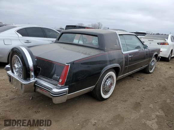 1985 Cadillac Eldorado z VIN 1G6EL5782FE634074, wystawiony jako Copart lot #44520964 z przebiegiem 74 425 mil mil oraz Szkody całkowita. Historia ofert i sprzedaży dostępna na DreamBid. Obrazek 3.