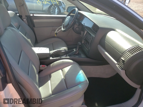2001 Cadillac Catera z VIN W06VR54RX1R070430, wystawiony jako Copart lot #37051650 z przebiegiem 74 568 mil mil oraz Szkody całkowita. Historia ofert i sprzedaży dostępna na DreamBid. Obrazek 5.