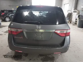 2012 Honda Odyssey EX-L with VIN 5FNRL5H63CB137198, listed as a IAAI auction lot 42706690 with 305,753 mi miles and . Bid and sale history available at DreamBid. Image 16.