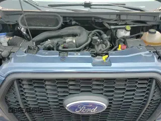 2023 Ford Transit Cargo z VIN 1FTBR2C8XPKA16703, wystawiony jako Copart lot #60164215 z przebiegiem 75 620 mil mil oraz Szkoda całkowita • Salvage title. Historia ofert i sprzedaży dostępna na DreamBid. Obrazek 14.