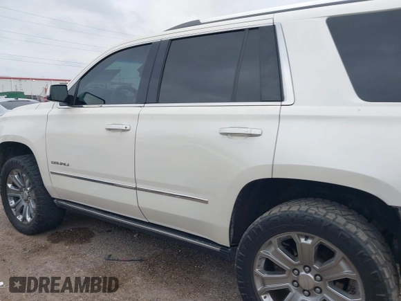 2015 GMC Yukon Denali z VIN 1GKS1CKJ3FR713531, wystawiony jako IAAI lot #41866691 z przebiegiem 157 666 mil mil oraz . Historia ofert i sprzedaży dostępna na DreamBid. Obrazek 15.