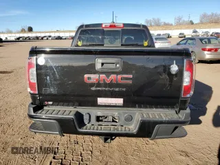 2021 GMC Canyon 4WD AT4 w/Cloth with VIN 1GTG6FEN9M1254293, listed as a Copart auction lot 87163874 with 33,645 mi miles and Salvage Title. Bid and sale history available at carsss.com. Image 6.