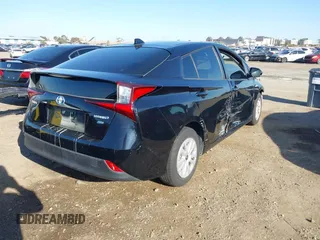 2021 Toyota Prius L Eco z VIN JTDKAMFU1M3134107, wystawiony jako IAAI lot #41763080 z przebiegiem 185 248 mil mil oraz . Historia ofert i sprzedaży dostępna na DreamBid. Obrazek 4.