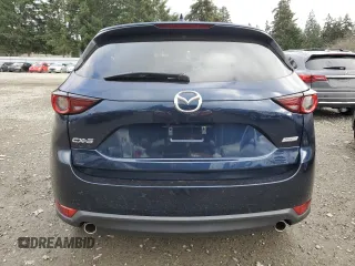 2018 Mazda CX-5 Touring with VIN JM3KFACM8J1349356, listed as a Copart auction lot 89154055 with 82,719 mi miles and Salvage Title. Bid and sale history available at carsss.com. Image 6.