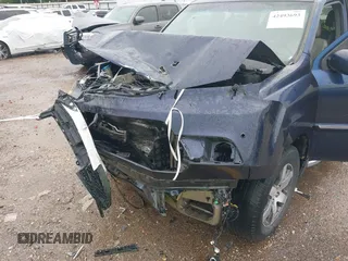 2013 Honda Pilot Touring with VIN 5FNYF4H95DB007125, listed as a IAAI auction lot 42493693 with Not provided miles and . Bid and sale history available at DreamBid. Image 6.