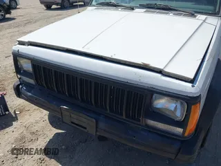 1996 Jeep Cherokee SE with VIN 1J4FT28S7TL307603, listed as a IAAI auction lot 42087278 with 141,994 mi miles. Bid and sale history available at carsss.com. Image 6.
