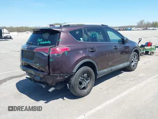 2016 Toyota RAV4 LE with VIN 2T3ZFREV4GW284902, listed as a IAAI auction lot 42054633 with 117,463 mi miles and . Bid and sale history available at carsss.com. Image 4.
