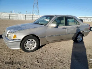 1998 Mercedes-Benz C 230/260/280/320 with VIN WDBHA23G5WA556665, listed as a Copart auction lot 83677634 with 153,901 mi miles and Salvage Title. Bid and sale history available at carsss.com. Image 1.