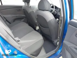 2008 Kia Rio LX with VIN KNADE123486430555, listed as a IAAI auction lot 41875641 with 121,280 mi miles. Bid and sale history available at carsss.com. Image 8.