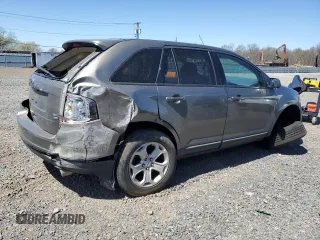 2014 Ford Edge SEL z VIN 2FMDK4JC7EBA36345, wystawiony jako Copart lot #53434145 z przebiegiem 184 955 mil mil oraz Szkoda całkowita • Salvage title. Historia ofert i sprzedaży dostępna na DreamBid. Obrazek 3.
