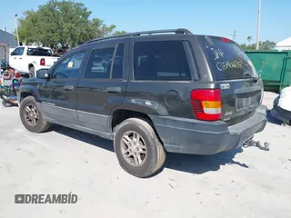 2004 Jeep Grand Cherokee Laredo with VIN 1J4GW48S74C401022, listed as a IAAI auction lot 41982319 with 170,607 mi miles. Bid and sale history available at carsss.com. Image 3.