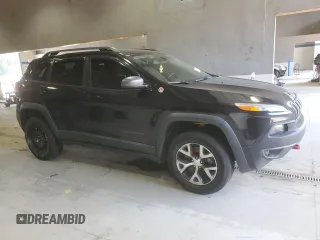 2014 Jeep Cherokee Trailhawk with VIN 1C4PJMBB8EW171116, listed as a Copart auction lot 60107215 with 168,979 mi miles and Salvage title. Bid and sale history available at DreamBid. Image 4.