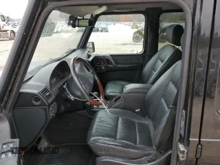 2002 Mercedes-Benz G-Class with VIN WDCYR49E12X133160, listed as a Copart auction lot 47310015 with 93,526 mi miles and Salvage Title. Bid and sale history available at carsss.com. Image 7.
