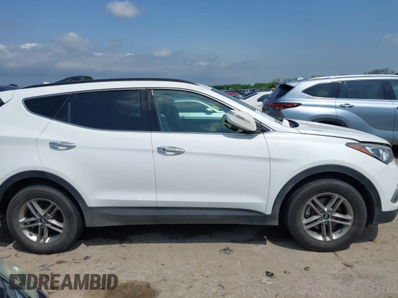 2018 Hyundai Santa Fe 2.4L z VIN 5NMZUDLB3JH055771, wystawiony jako IAAI lot #42126058 z przebiegiem 142 991 mil mil oraz . Historia ofert i sprzedaży dostępna na DreamBid. Obrazek 13.