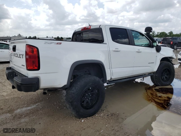 2021 Chevrolet Colorado 4WD ZR2 with VIN 1GCGTEEN0M1108190, listed as a Copart auction lot 54159655 with 64,447 mi miles and Salvage Title. Bid and sale history available at carsss.com. Image 3.