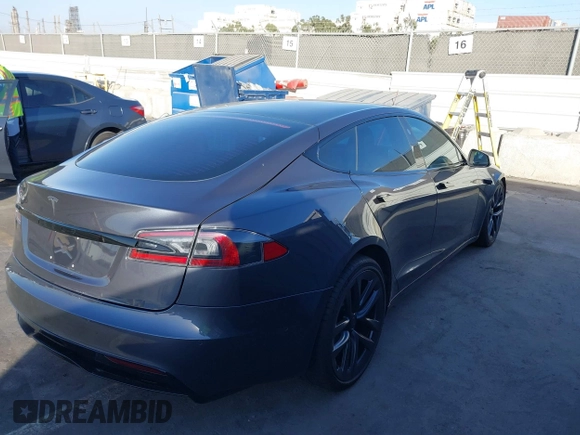 2021 Tesla Model S Long Range with VIN 5YJSA1E53MF436865, listed as a IAAI auction lot 41384837 with 20,829 mi miles and . Bid and sale history available at DreamBid. Image 4.