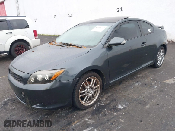 2010 Scion tC with VIN JTKDE3B75A0314185, listed as a IAAI auction lot 41369224 with 164,244 mi miles. Bid and sale history available at carsss.com. Image 2.