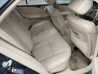 2002 Mercedes-Benz E-Class AWD with VIN WDBJF83J32X068355, listed as a IAAI auction lot 41872613 with 143,501 mi miles. Bid and sale history available at carsss.com. Image 8.