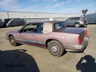 1988 Cadillac Eldorado with VIN 1G6EL1153JU632470, listed as a Copart auction lot 78507684 with 176,894 mi miles and Salvage Title. Bid and sale history available at DreamBid. Image 2.