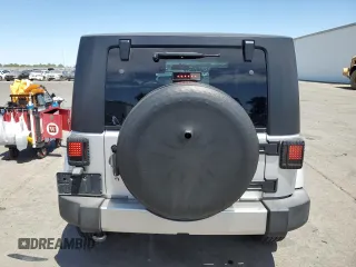 2009 Jeep Wrangler Sahara with VIN 1J4FA54149L708183, listed as a Copart auction lot 65989125 with 133,436 mi miles and Salvage title. Bid and sale history available at DreamBid. Image 6.