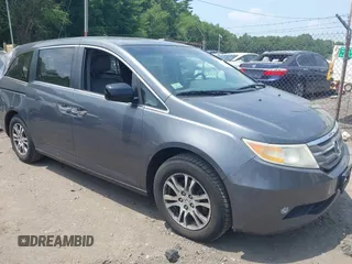 2011 Honda Odyssey EX-L with VIN 5FNRL5H62BB101744, listed as a IAAI auction lot 42526913 with 169,741 mi miles and . Bid and sale history available at DreamBid. Image 1.