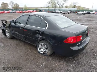 2007 Kia Optima LX with VIN KNAGE123175133499, listed as a IAAI auction lot 41958955 with 132,480 mi miles. Bid and sale history available at carsss.com. Image 3.