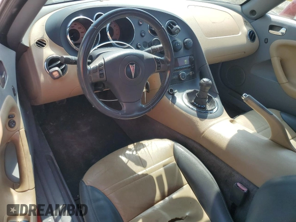 2007 Pontiac Solstice z VIN 1G2MB35BX7Y137681, wystawiony jako Copart lot #67002804 z przebiegiem 133 295 mil mil oraz Szkoda całkowita • Salvage title. Historia ofert i sprzedaży dostępna na DreamBid. Obrazek 8.