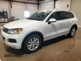 2014 Volkswagen Touareg Sport with VIN WVGEF9BP5ED004852, listed as a Copart auction lot 52729125 with 156,859 mi miles and Clean title. Bid and sale history available at DreamBid. Image 1.