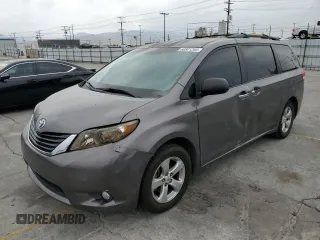 2011 Toyota Sienna with VIN 5TDZK3DC1BS148794, listed as a Copart auction lot 60801205 with 205,726 mi miles and Salvage title. Bid and sale history available at DreamBid. Image 1.