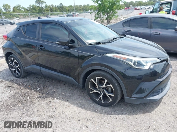 2018 Toyota C-HR XLE with VIN NMTKHMBX0JR008423, listed as a IAAI auction lot 42091445 with 124,811 mi miles. Bid and sale history available at carsss.com. Image 1.
