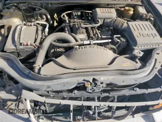 1999 Jeep Grand Cherokee Laredo with VIN 1J4G258S0XC561054, listed as a Copart auction lot 49814555 with Not provided miles and Salvage title. Bid and sale history available at DreamBid. Image 12.