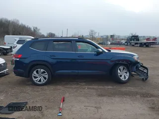 2023 Volkswagen Atlas SE z VIN 1V2KR2CA8PC504298, wystawiony jako IAAI lot #41234957 z przebiegiem 34 762 mil mil oraz . Historia ofert i sprzedaży dostępna na DreamBid. Obrazek 13.