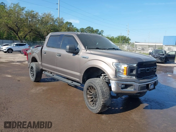 2018 Ford F-150 XL with VIN 1FTEW1EG1JFC31794, listed as a IAAI auction lot 41304111 with 129,058 mi miles and . Bid and sale history available at carsss.com. Image 1.