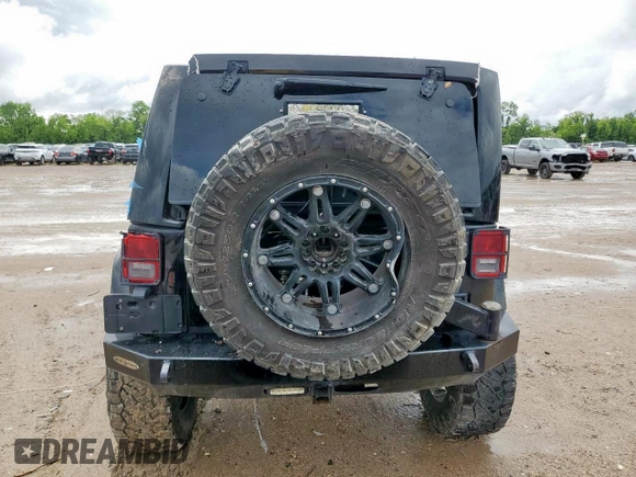 2015 Jeep Wrangler Unlimited Rubicon Hard Rock with VIN 1C4HJWFG1FL710264, listed as a Copart auction lot 54123285 with 96,737 mi miles and Salvage title. Bid and sale history available at DreamBid. Image 6.