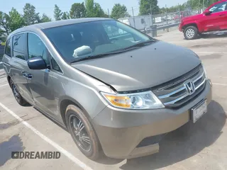 2011 Honda Odyssey LX z VIN 5FNRL5H2XBB030449, wystawiony jako IAAI lot #42159992 z przebiegiem 173 965 mil mil oraz . Historia ofert i sprzedaży dostępna na DreamBid. Obrazek 1.