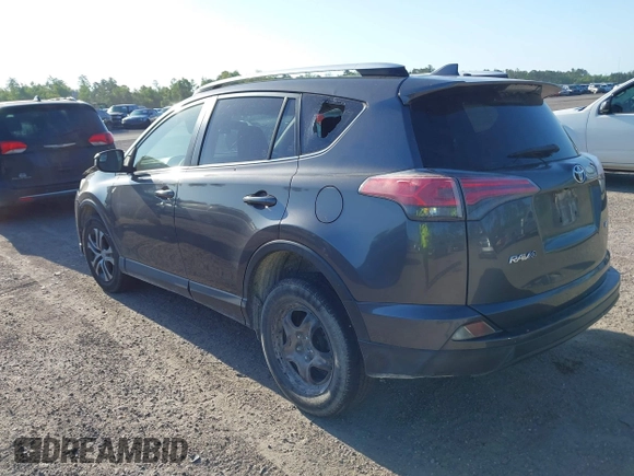 2016 Toyota RAV4 LE with VIN JTMZFREV7GJ065267, listed as a IAAI auction lot 42011267 with 180,127 mi miles. Bid and sale history available at carsss.com. Image 3.