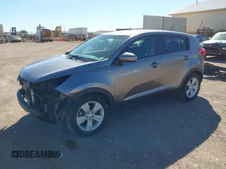 2012 Kia Sportage LX with VIN KNDPBCA27C7318056, listed as a IAAI auction lot 41887312 with 144,940 mi miles and . Bid and sale history available at DreamBid. Image 2.