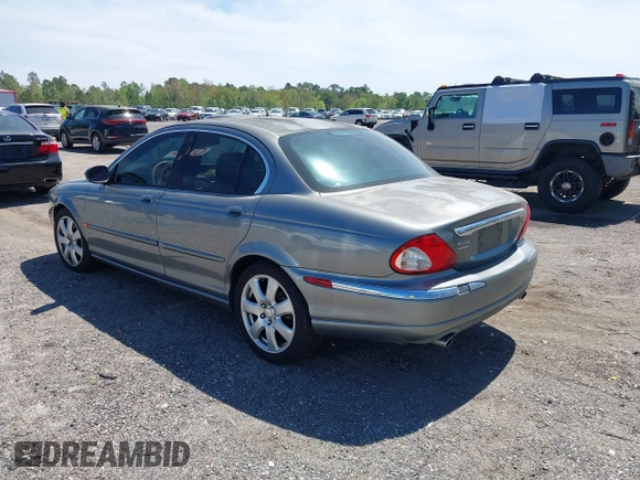 2004 Jaguar X-Type with VIN SAJEA51C04WD73023, listed as a IAAI auction lot 41874488 with 199,333 mi miles and . Bid and sale history available at DreamBid. Image 3.